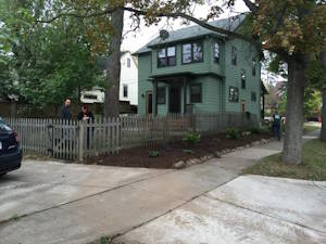 Adjusting Fencing, Removing Overgrown Plants, and Adding Landscaping: After